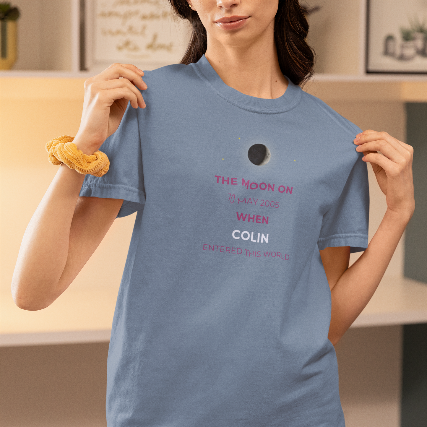 Person wearing a blue t-shirt with text about a celestial event.