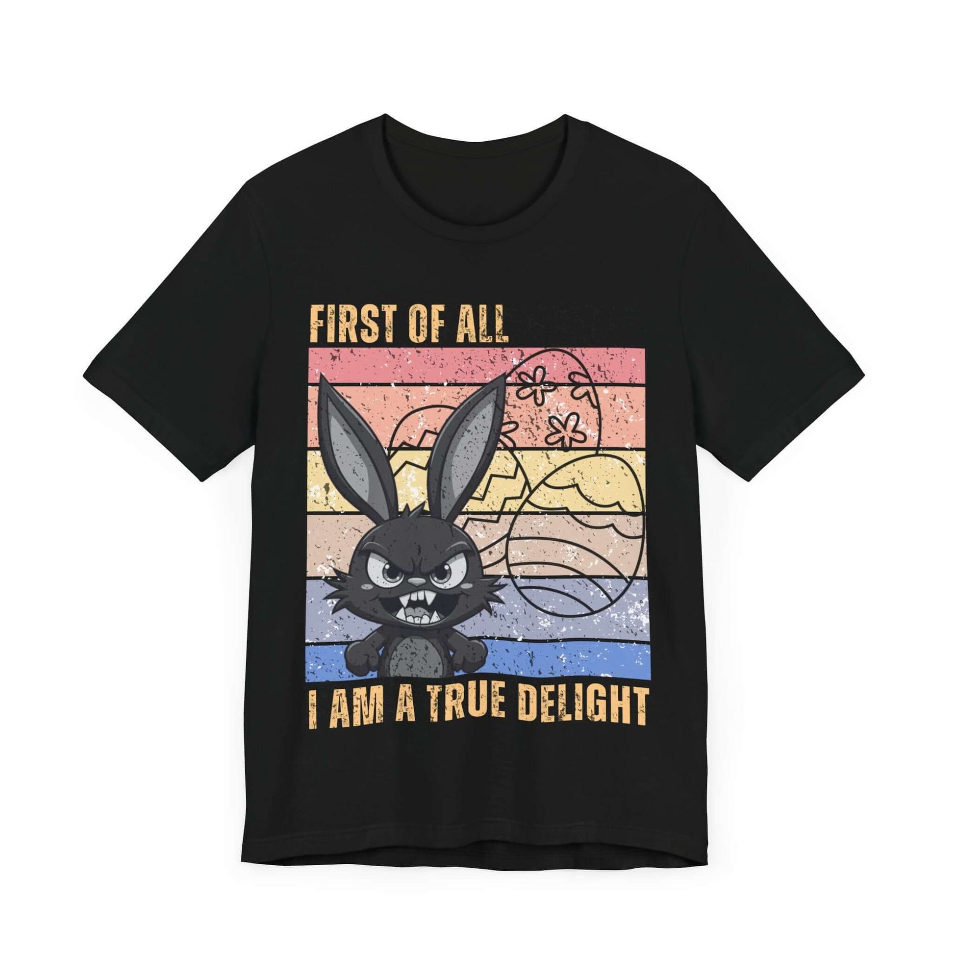 Black graphic T-shirt with a retro rainbow-colored design featuring a fierce bunny, Easter eggs, and the phrase “First of All, I Am a True Delight.” A bold and funny bunny shirt perfect for spring sass and chaotic energy.