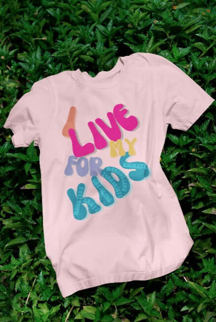 Pink t-shirt with colorful "I Live for My Kids" design featuring playful nicknames like monsters and rugrats