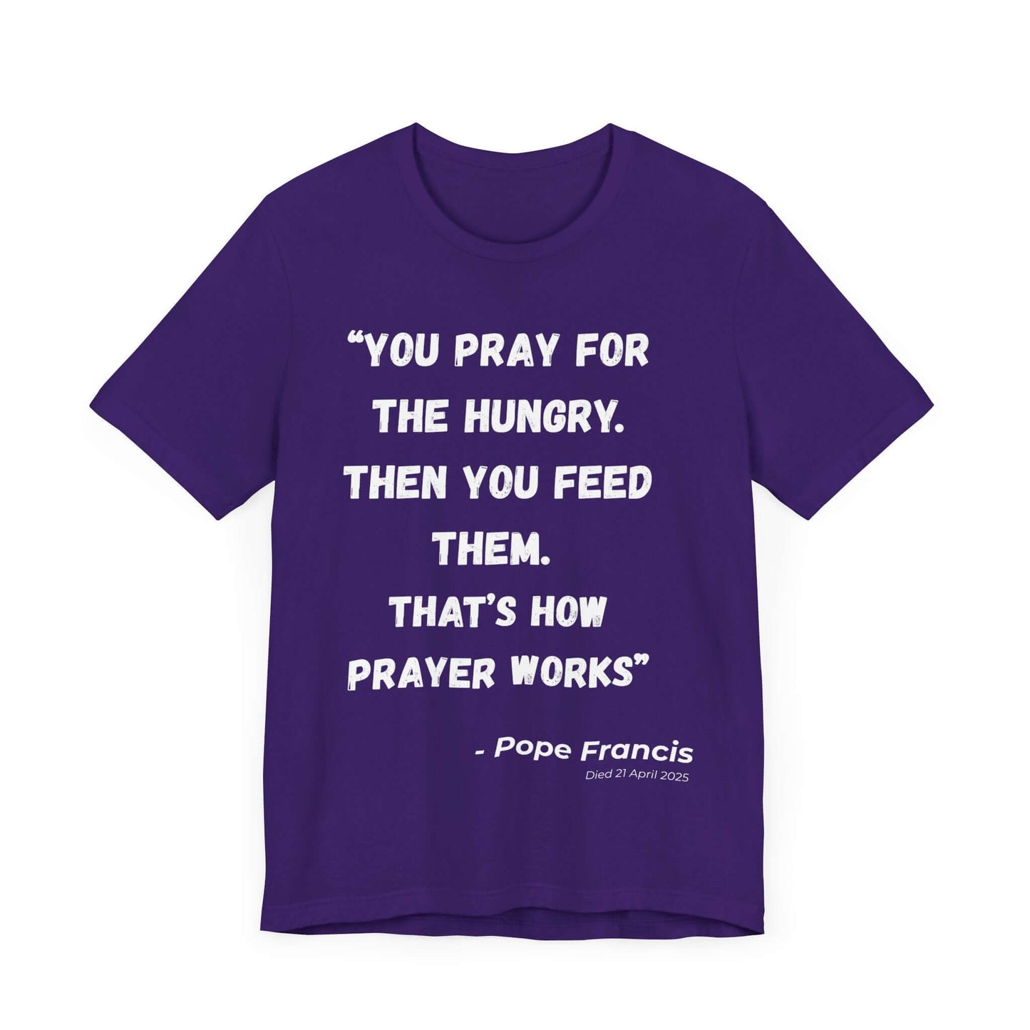 Purple t-shirt with a spiritual message from Pope Francis printed in bold white text. A Catholic Church-inspired design ideal for Lent, reflection, or tribute wear.