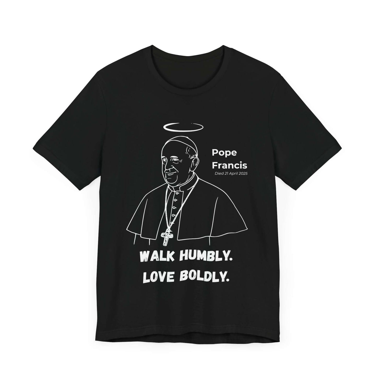 Black t-shirt featuring white line art of Pope Francis with halo, papal vestments, and cross. Below, the quote “Walk Humbly. Love Boldly.” A Catholic memorial design reflecting humble leadership and compassion.