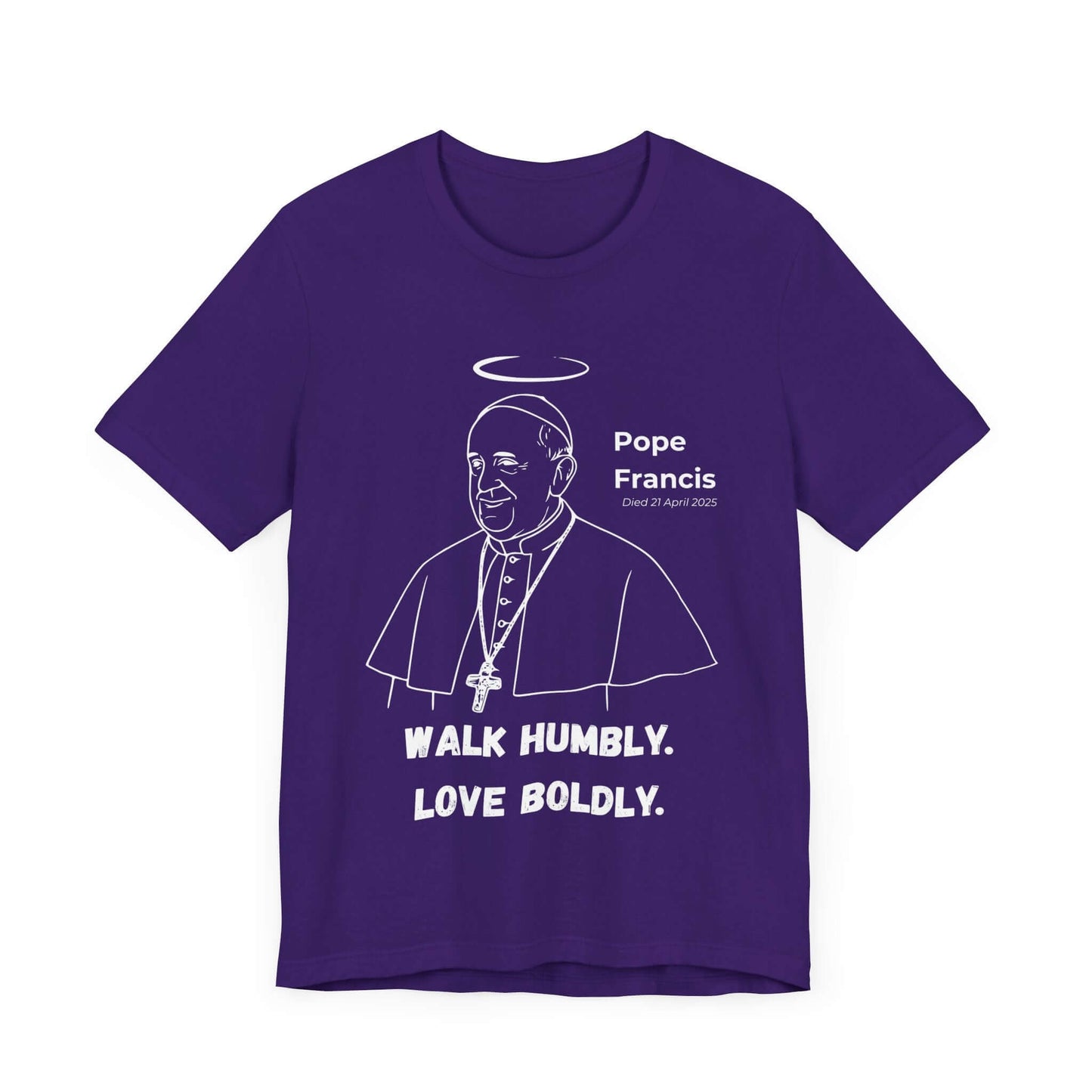 Purple t-shirt with minimalist design of Pope Francis and a white halo, paired with bold lettering reading “Walk Humbly. Love Boldly.” A Catholic-inspired tee symbolizing peace, unity, and spiritual leadership.