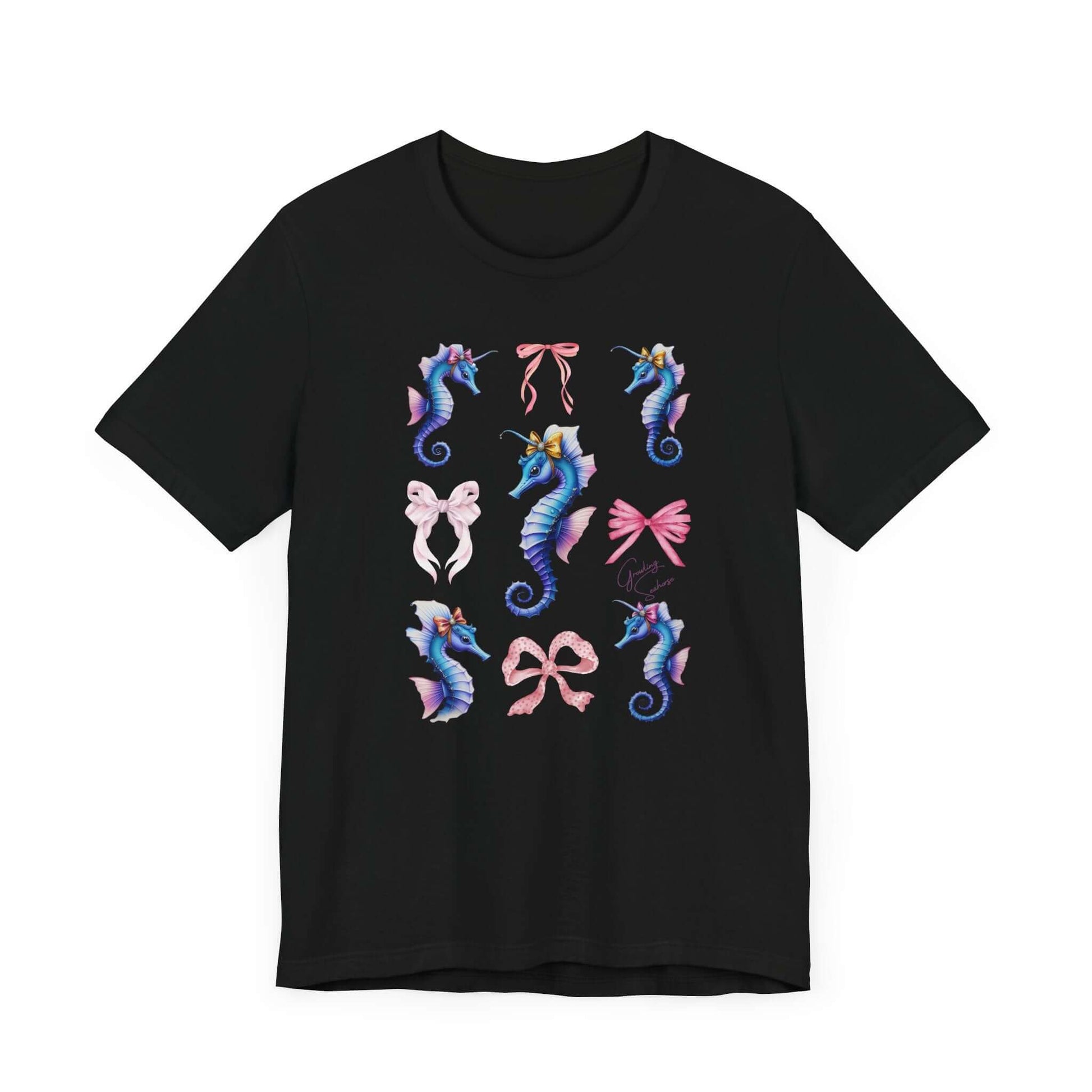 Unisex black shirt with dreamy Coquette marine design. Features adorable flower-crowned seahorses, pink ribbon graphics, and soft feminine energy.