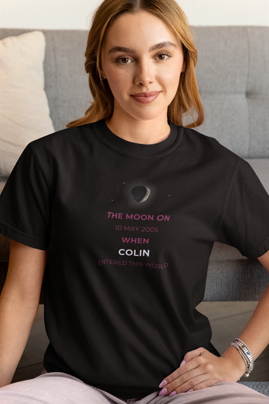 Woman wearing a black t-shirt with text and a graphic of the moon.