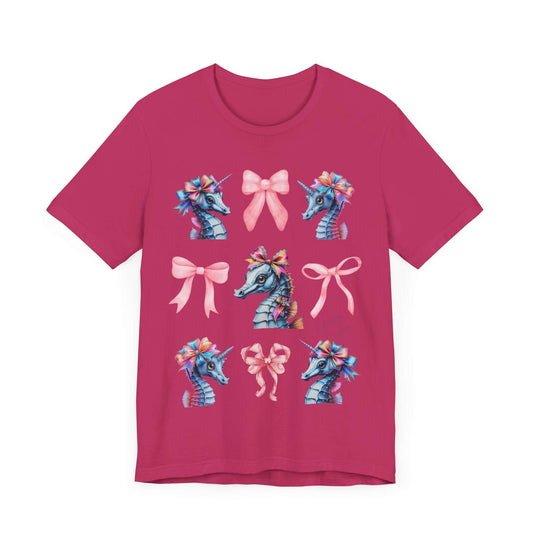 Berry red shirt featuring a collection of pastel seahorses with unicorn-like manes and oversized pink bows. Surrounded by floating ribbons. A dreamy cottagecore and coquette-core fashion statement.