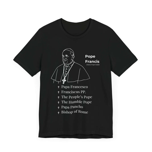 Black t-shirt with minimalist white outline of Pope Francis, including a halo and detailed cassock. Below the image, titles like “The Humble Pope,” “Franciscus PP,” and “Papa Francesco” honor his life and service. A powerful Catholic memorial shirt for remembrance and respect.