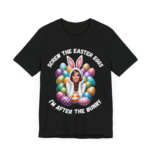 Black t-shirt with a bold Easter design showing a woman in a playful bunny costume, sitting among colorful Easter eggs. The caption reads “Screw the Easter Eggs, I’m After the Bunny” in bold white text above and below the image. A funny, flirty graphic tee perfect for adult Easter parties, sassy spring style, and cheeky humor lovers.